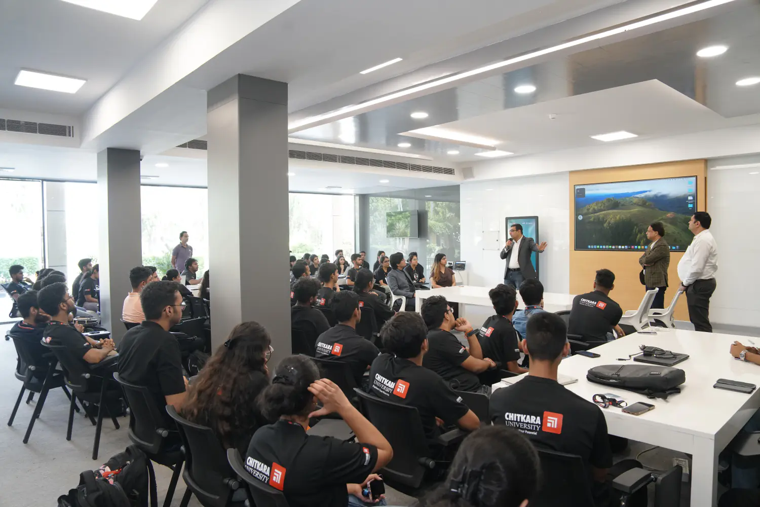 A guest speaker addressing students in a seminar room